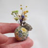 Smaller Raccoon Egg (with dried flowers)