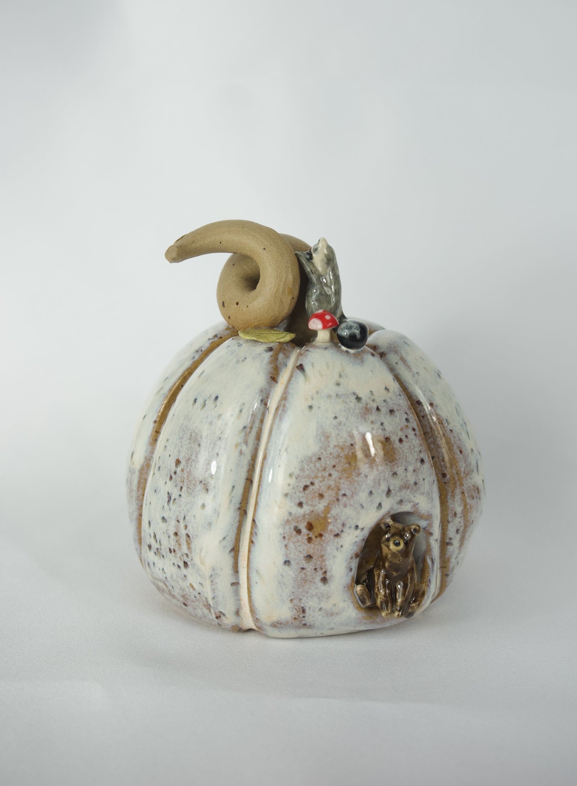 Pumpkin Sculpture featuring Brown bear and raccoon