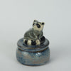 Sitting Raccoon Trinket