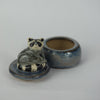 Sitting Raccoon Trinket