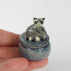 Sitting Raccoon Trinket