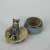 Leaf Laying Raccoon Trinket