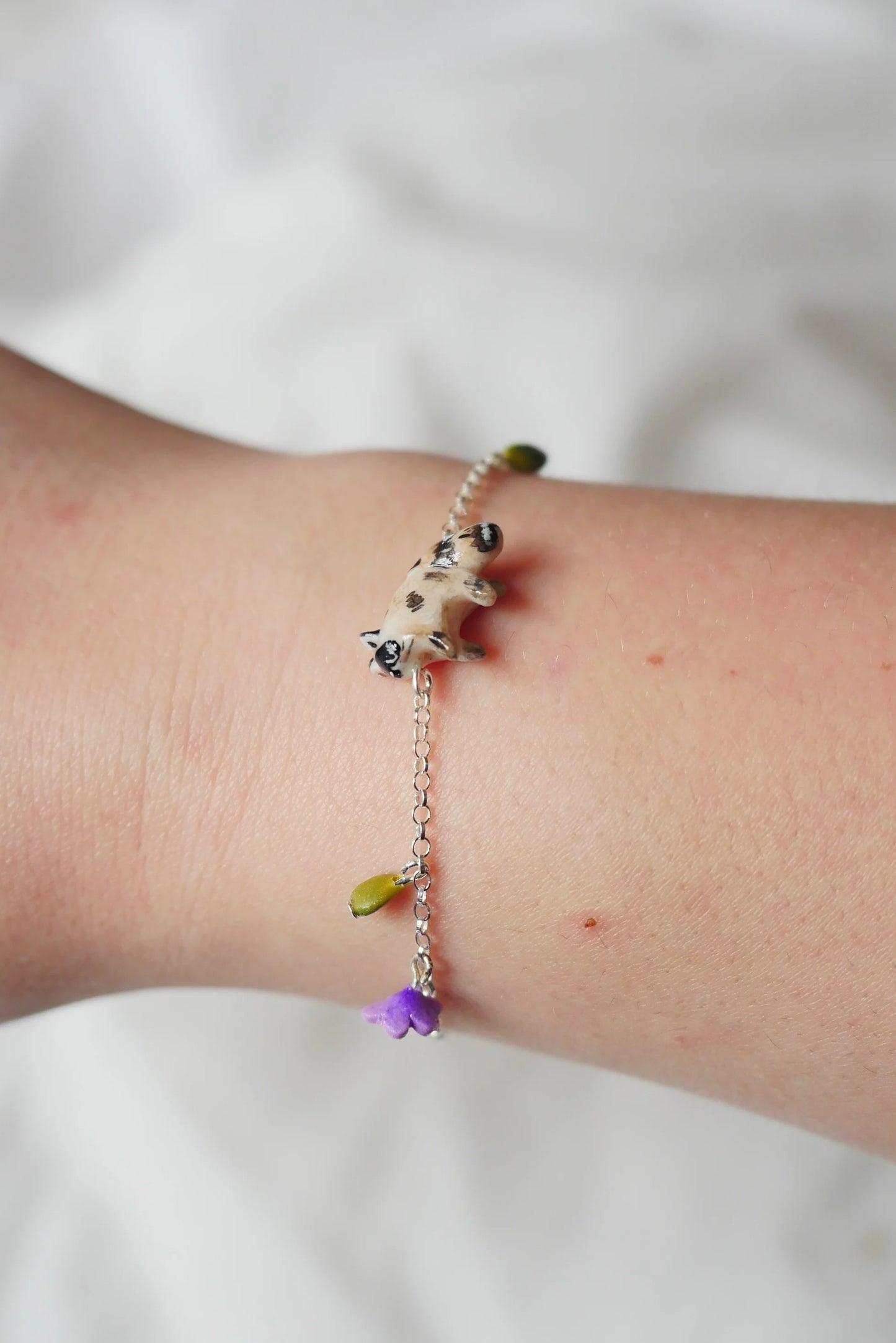 Personalised raccoon bracelet and purple flower charm with clasp